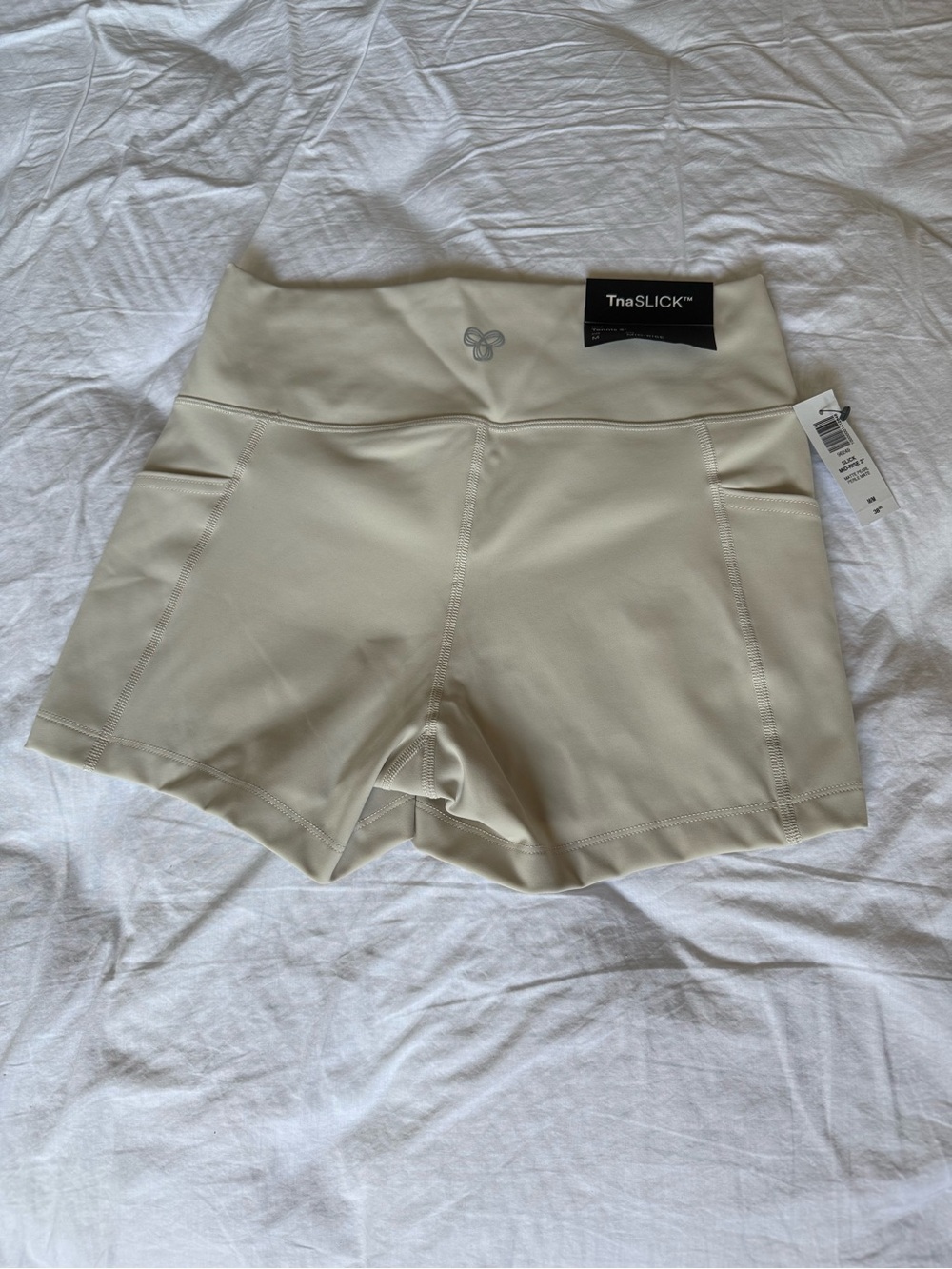 BNWT TNA Slick mid rise shorts